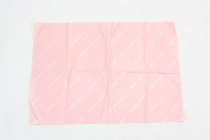 ピンクの化粧品包装紙